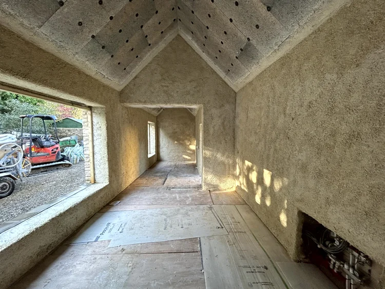 Barn conversion interior showing exposed hempcrete walls