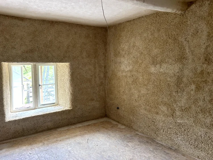 Exposed hempcrete finish, interior corner detail, Suffolk barn conversion